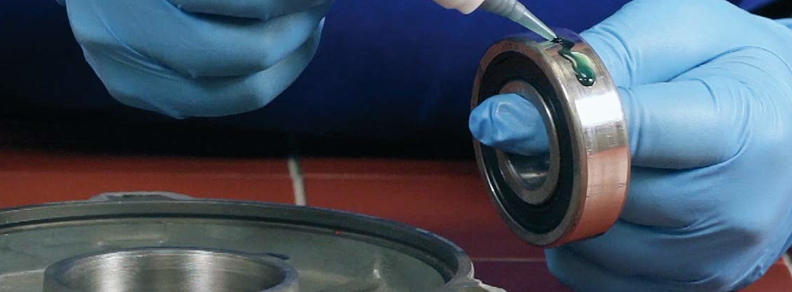 WEICON retaining compound being applied on bearing before assembly